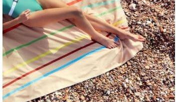 7 Sustainable Beach Towels For Eco-Friendly Fun Under The Sun by sustainably-chic