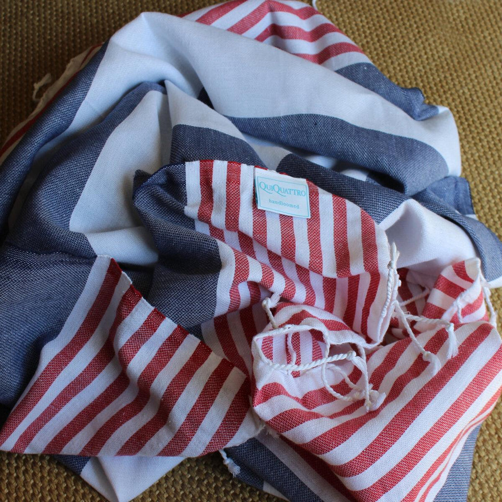 red, white, blue striped Turkish towel